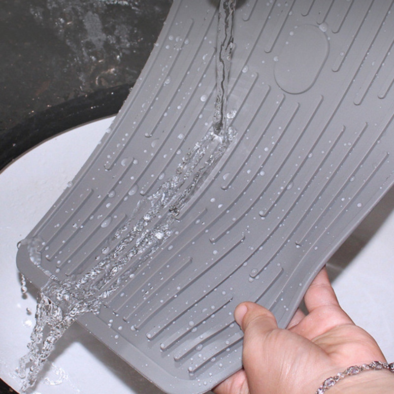 Rechteckiger Knopf zum Halten des Abflusskissens